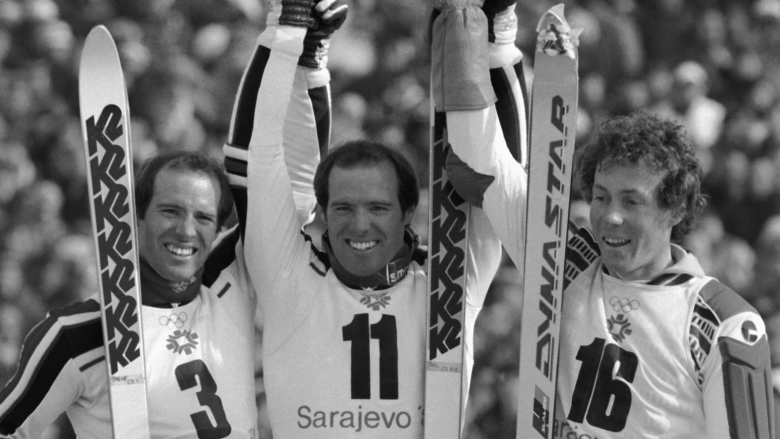 Phil Mahre (11) stands with his brother Steve (3) and Didier Bouvet (16) of France after the XIV Winter Olympics slalom on Mt. Bjelasnica in Sarajevo, Feb. 19, 1984. Americans Phil and Steve took top  ...