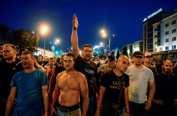 epaselect epa08596569 People react during a protest the day after the presidential election, in Minsk, Belarus, 10 August 2020. Long-time President of Belarus Alexander Lukashenko won the elections by ...