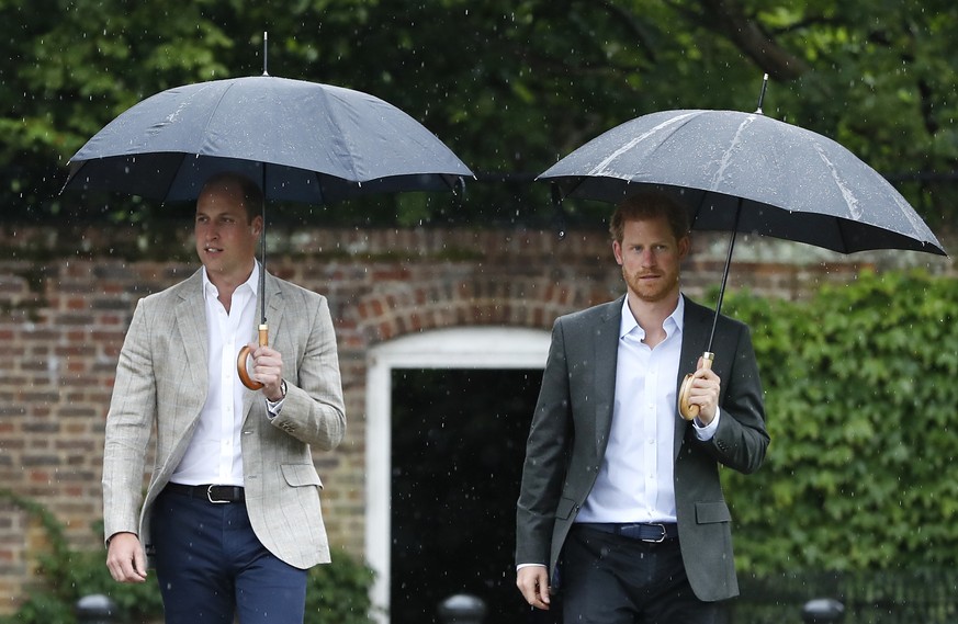 FILE - In this Wednesday, Aug. 30, 2017 file photo, Britain&#039;s Prince William, left, and Prince Harry arrive for an event at the memorial garden in Kensington Palace, London. Britain&#039;s Queen  ...