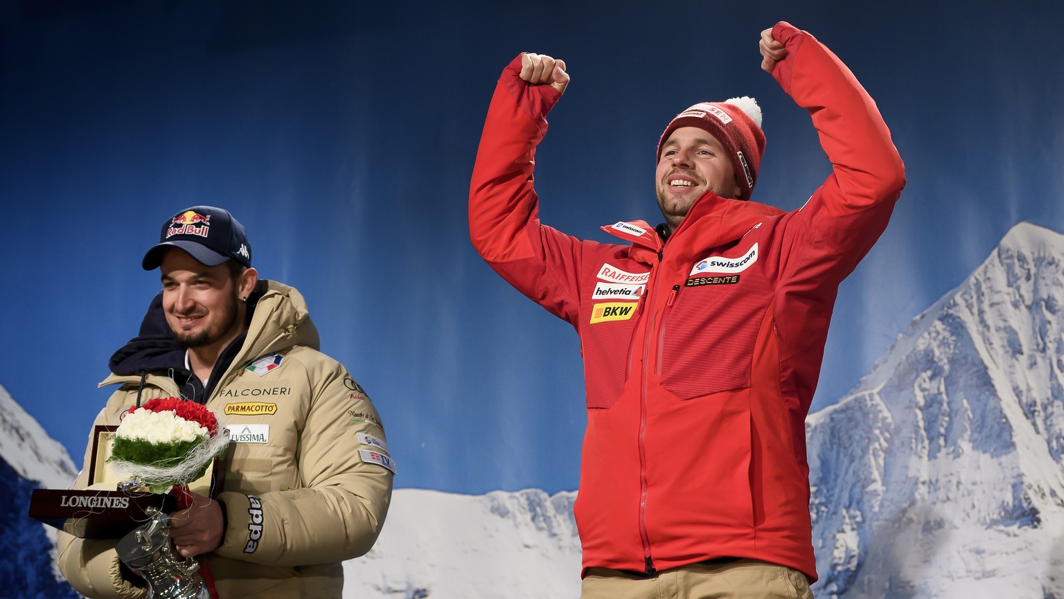 The winner Beat Feuz of Switzerland, center, Italy&#039;s Dominik Paris, seconde place, left, and Germany&#039;s Thomas Dressen, third place, right, celebrate during the prize giving ceremony after th ...