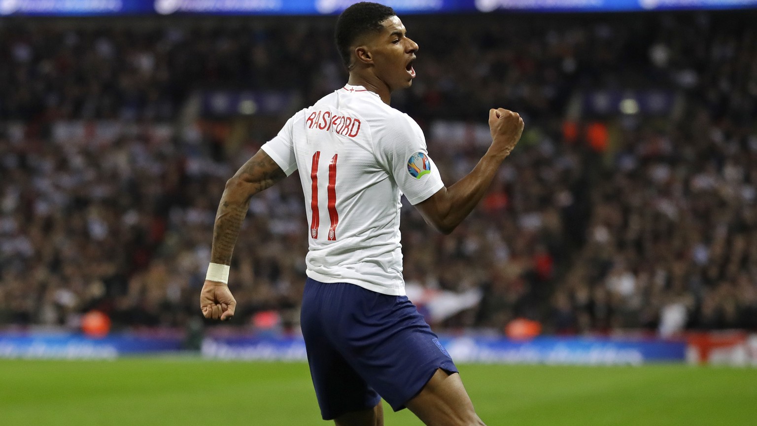 England&#039;s Marcus Rashford celebrates scoring his side&#039;s fourth goal during the Euro 2020 group A qualifying soccer match between England and Montenegro at Wembley stadium in London, Thursday ...