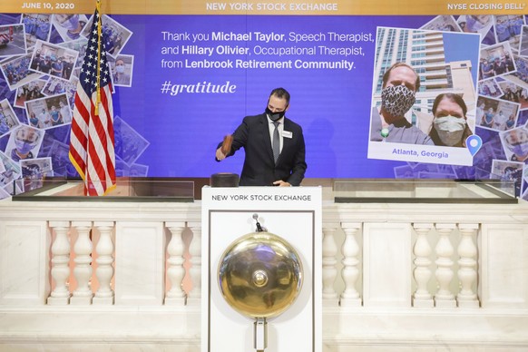 IMAGE DISTRIBUTED FOR THE NEW YORK STOCK EXCHANGE - The NYSE&#039;s honorary Closing Bell ringers Michael Taylor, speech therapist, and Hillary Olivier, occupational therapist, Lenbrook Retirement Com ...