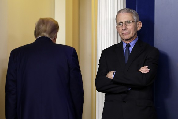epa08325568 Director of the National Institute of Allergy and Infectious Diseases Dr. Anthony Fauci reacts as US President Donald J. Trump leaves after his press briefing on the Coronavirus COVID-19 p ...