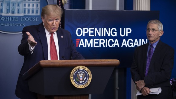 President Donald Trump speaks about the coronavirus, accompanied by Dr. Anthony Fauci, director of the National Institute of Allergy and Infectious Diseases, in the James Brady Press Briefing Room of  ...