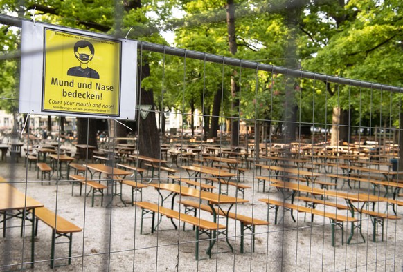 epa08426713 An empty benches and tables at the Hirschgarten beergarden in Munich, Bavaria, Germany, 16 May 2020. To slow down the spread of the coronavirus CovID 19 pandemic, beer gardens and restaura ...