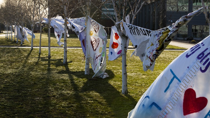 Sheets with messages of support for health care workers fly in the wind outside Bernhoven hospital in Uden, southern Netherlands, Monday, March 23, 2020. The country have come to a near standstill as  ...