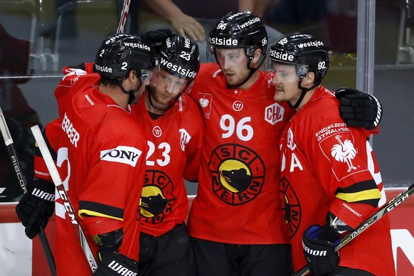 Bern&#039;s Beat Gerber, Simon Bodenmann, Dario Meyer and Gaetan Haas (L-R) celebrate after Meyer scored the 4-1 during the Champions Hockey League group F match between Switzerland&#039;s SC Bern and ...