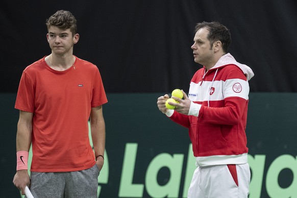 epa07333153 Switzerland&#039;s Davis Cup team captain Severin Luethi (R) and his team player Jerome Kym, look on during a training session in the Swiss Tennis Arena in Biel, Switzerland, on 31 January ...