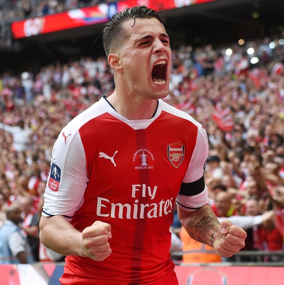 epa05994292 Arsenal Granit Xhaka celebrates after Aaron Ramsey scored against Chelsea during the FA Cup final match Arsenal vs Chelsea at Wembley Stadium in London, Britain, 27 May 2017. EPA/ANDY RAIN ...