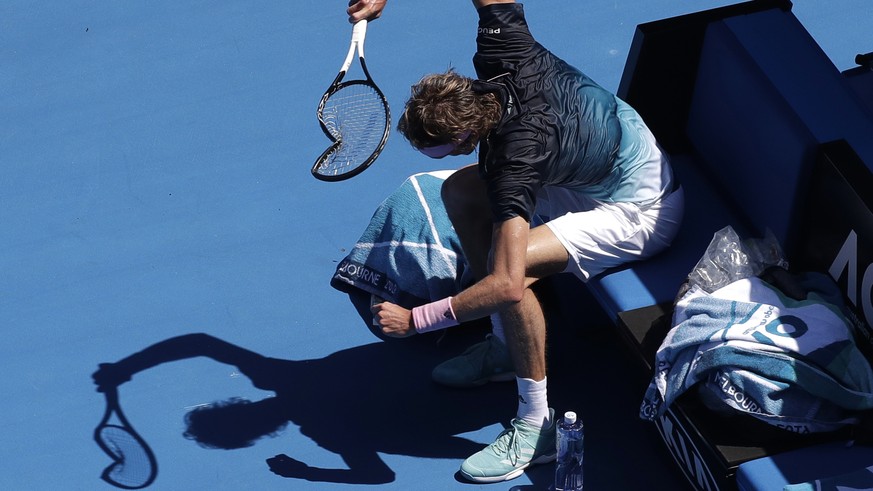 Germany&#039;s Alexander Zverev smashes his racket in frustration during his fourth round match against Canada&#039;s Milos Raonic at the Australian Open tennis championships in Melbourne, Australia,  ...