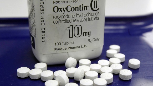 FILE - This Feb. 19, 2013, file photo shows OxyContin pills arranged for a photo at a pharmacy, in Montpelier, Vt. Five state attorneys general announced lawsuits Thursday, May 16, 2019, seeking to ho ...