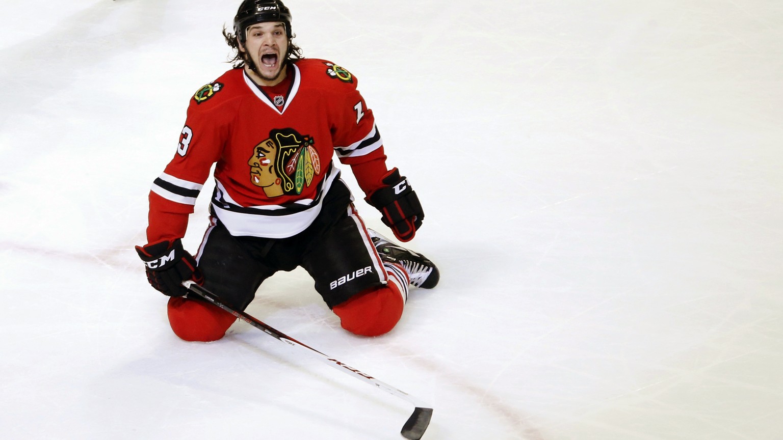 FILE - In this March 6, 2013, file photo, Chicago Blackhawks left wing Daniel Carcillo celebrates his winning goal during the third period of an NHL hockey game against the Colorado Avalanche, in Chic ...