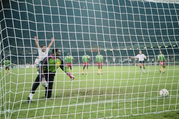 Gary Lineker of England scores the second penalty against goalkeeper Thomas Nkono of the Cameroon during the 1990 FIFA World Cup Quarter Final on 1 July 1990 at the San Paolo Stadium in Naples, Italy. ...