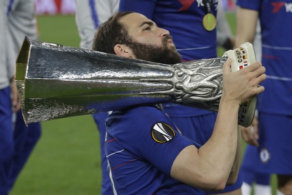Chelsea&#039;s Gonzalo Higuain celebrates with the trophy after winning the Europa League Final soccer match between Arsenal and Chelsea at the Olympic stadium in Baku, Azerbaijan, Wednesday, May 29,  ...