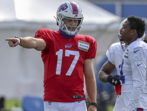 Buffalo Bills quarterback Josh Allen (17) talks to Buffalo Bills wide receiver Stefon Diggs (14) during a passing drill in the second day of training camp opened to the media at ADPRO Sports Training  ...