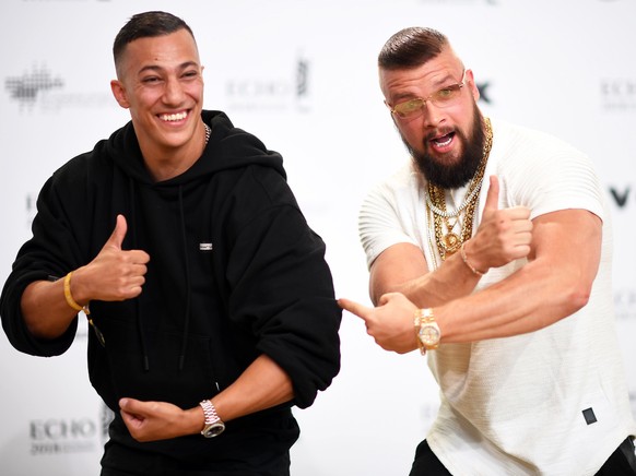 epa06691718 (FILE) - German musicians Kollegah (R) and Farid Bang (L) pose on the red carpet as they attend the 27th Echo 2018 music awards in Berlin, Germany, 12 April 2018. According to media report ...