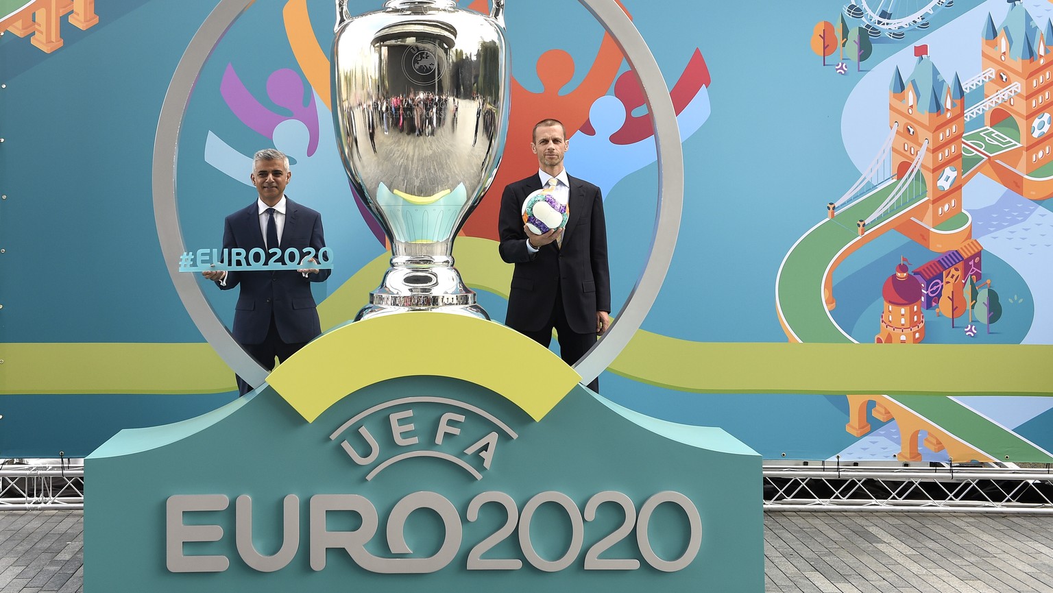 epa08300426 (FILE) - UEFA president Aleksander Ceferin (R) and London mayor Sadiq Khan (L) during the unveiling of the UEFA EURO 2020 tournament and the host city logo in the City Hall in London, Brit ...
