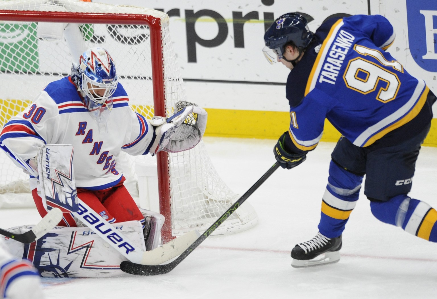 New York Rangers goalie Henrik Lundqvist (30), of Sweden, blocks a shot by St. Louis Blues&#039; Vladimir Tarasenko (91), of Russia, during the second period of an NHL hockey game Monday, Dec. 31, 201 ...