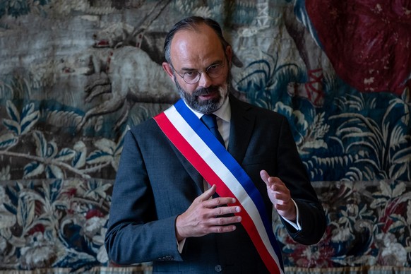 epa08498830 French Prime Minister and candidate for Le Havre city hall Edouard Philippe celebrates a wedding in Le Havre, Normandy, France, 20 June 2020, during a campaign visit ahead of the second ro ...
