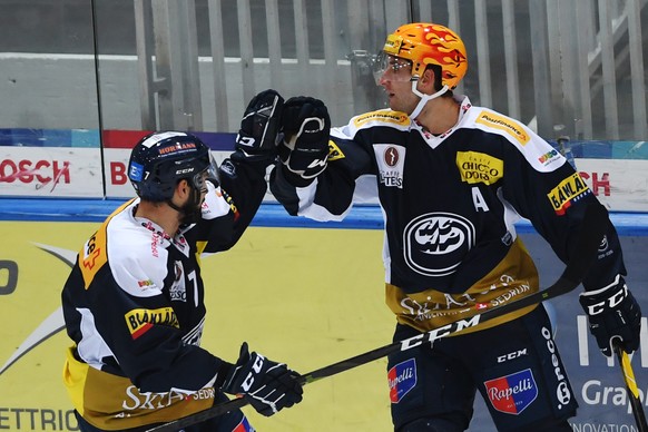 Ambri&#039;s player Michael Fora,, right celebrate with team mate the 1-0 goal, during the preliminary round game of National League A (NLA) Swiss Championship 2019/20 between HC Ambri Piotta and HC F ...