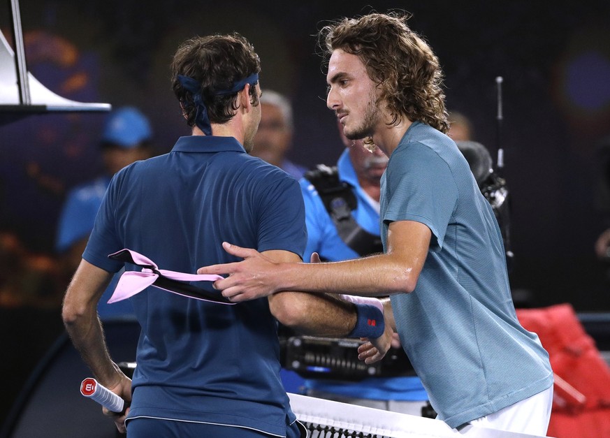 Greece&#039;s Stefanos Tsitsipas, right, is congratulated by Switzerland&#039;s Roger Federer after winning their fourth round match at the Australian Open tennis championships in Melbourne, Australia ...