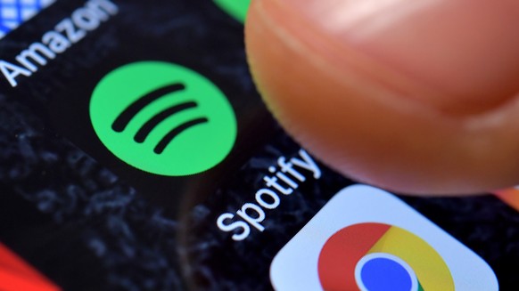epa09044615 (FILE) - A close-up image showing the Spotify Music app on an iPhone in Kaarst, Germany, 08 November 2017 (reissued 01 March 2021). Spotify confirmed on 01 March 2021 it had removed hundre ...
