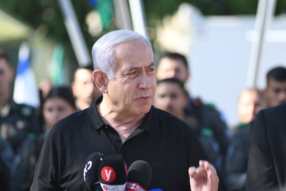 epa09197059 Israeli Prime Minister Benjamin Netanyahu delivers a speech as he meets with Israeli border police, after a wave of violence in the city between Arab and Jewish in the Israeli city of Lod, ...