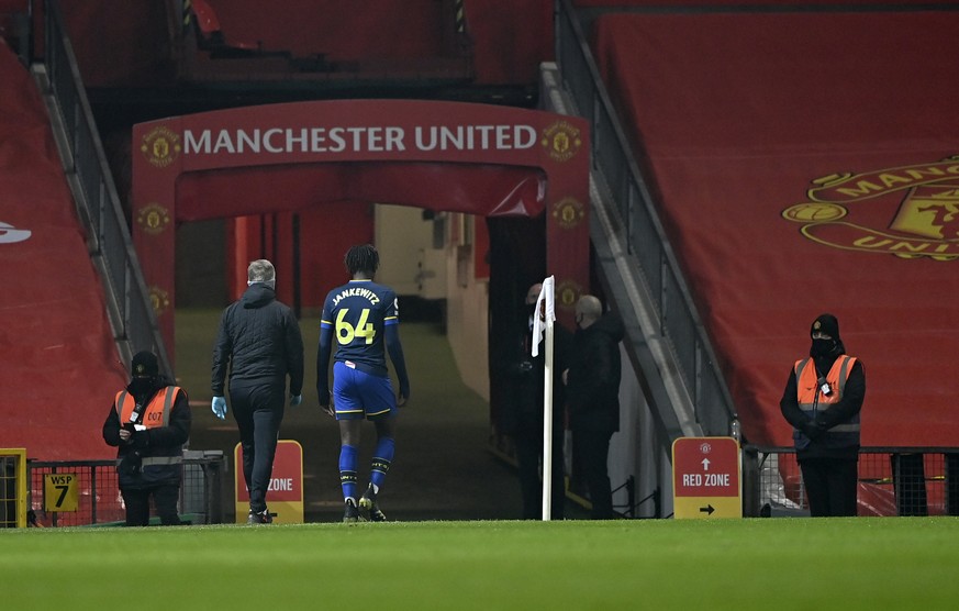 Southampton&#039;s Alex Jankewitz, centre, leaves the field after receiving red card during the English Premier League soccer match between Manchester United and Southampton, at the Old Trafford stadi ...