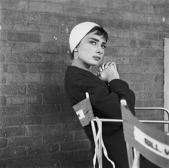 Belgian-born actress Audrey Hepburn (1929 - 1993) on the set of director Billy Wilder&#039;s film, &#039;Sabrina&#039; (aka &#039;Sabrina Fair&#039;), New York, October 1953. She is wearing a skirt su ...
