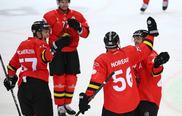 SCB&#039;s Mika Pyoeraelae, 2nd L, celebrates his goal with Jeremie Kamerzin, Maxim Noreau and Andrew Ebbett, L-R, during the Champions Hockey League group F match between Switzerland&#039;s SC Bern a ...
