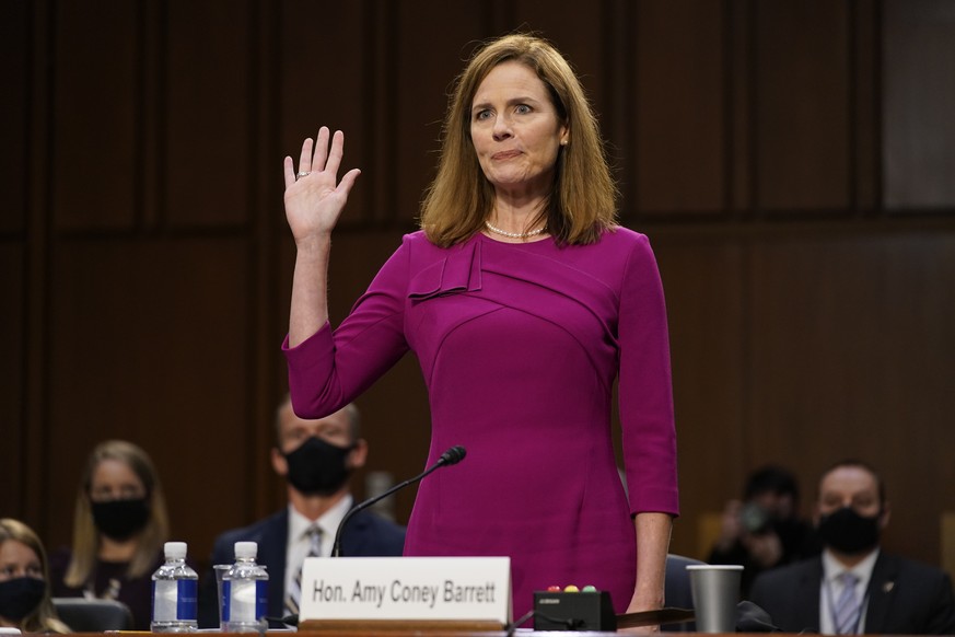 Supreme Court nominee Amy Coney Barrett is sworn in during a confirmation hearing before the Senate Judiciary Committee, Monday, Oct. 12, 2020, on Capitol Hill in Washington. (AP Photo/Patrick Semansk ...