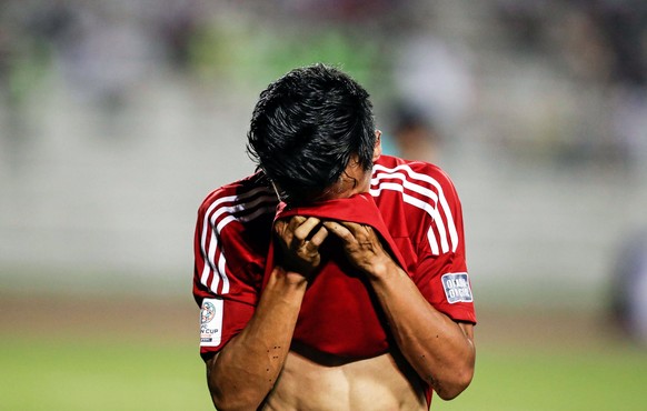 epa05875437 Bikram Lama of Nepal reacts after receiving a red card during the 2019 AFC Asian Cup Qualification Final Round soccer match between the Philippines and Nepal at the Rizal Memorial Stadium  ...