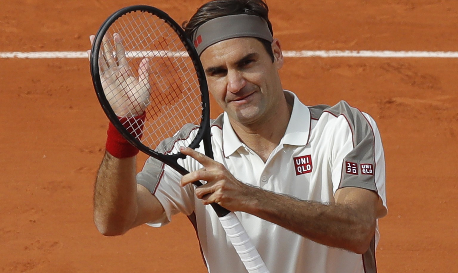 Switzerland&#039;s Roger Federer celebrates winning his second round match of the French Open tennis tournament against Germany&#039;s Oscar Otte in three sets 6-4, 6-3, 6-4, at the Roland Garros stad ...
