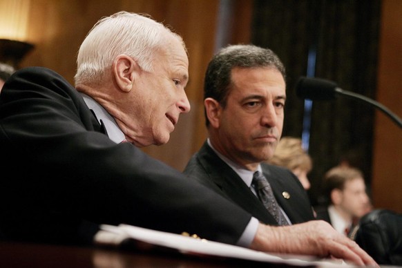 US Senators John McCain (L)(Republican\Arizona) and Russell Feingold (R)(Democrat\Wisconsin) talk during the Senate Homeland Security and Governmental Affairs Committee hearing on lobbying reform on C ...