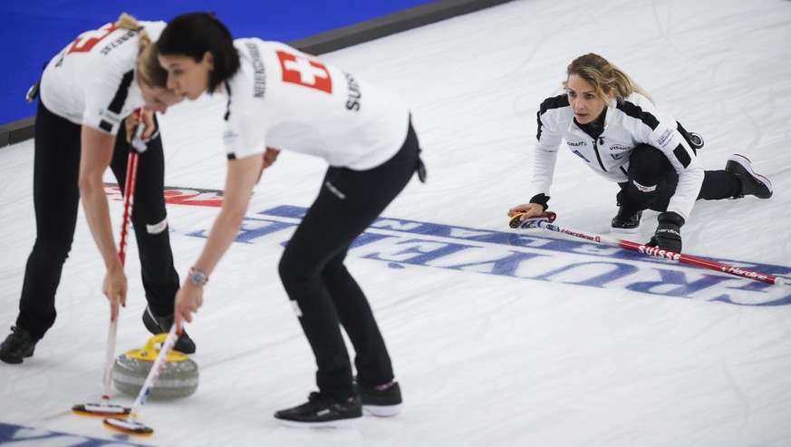 Switzerland skip Silvana Tirinzoni, right, directs her teammates against Russia in the final at the women&#039;s world curling championship in Calgary, Alberta, Sunday, May 9, 2021. (Jeff McIntosh/The ...
