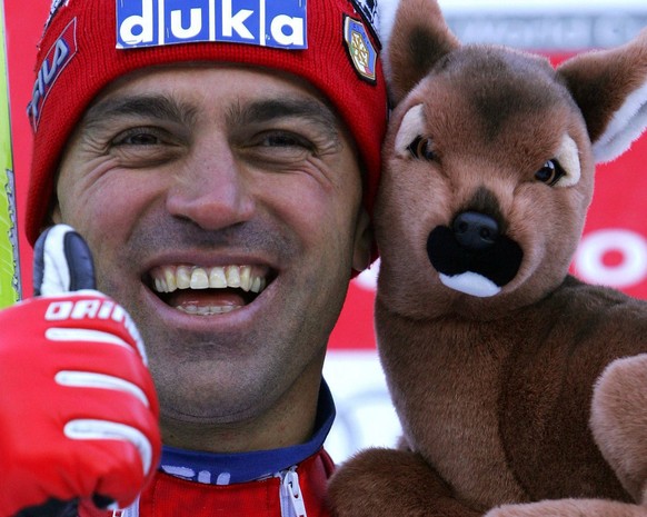 Italy&#039;s Kristian Ghedina celebrates on the podium after his second place time in the men&#039;s World Cup Downhill race in Chamonix, France, Saturday, 08 January 2005. Johann Grugger of Austria w ...