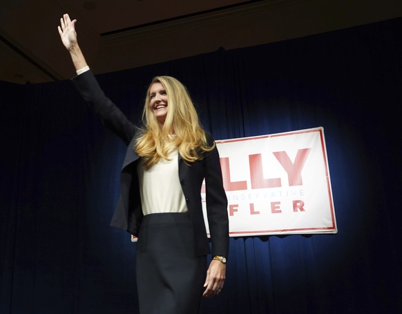 Republican candidate for Sen. Kelly Loeffler waves to supporters at an election night watch party Tuesday, Nov. 3, 2020, in Atlanta. (AP Photo/Tami Chappell)