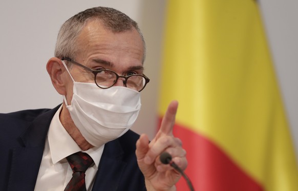 Belgium&#039;s Minister of Health and Social Affairs Frank Vandenbroucke waits for the start of a media conference, after a committee to discuss new restrictive measures regarding coronavirus, COVID-1 ...