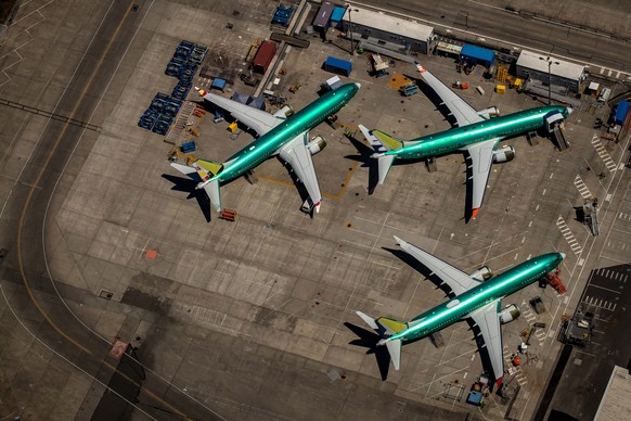 epa07732644 Boeing 737 Max 8 aircraft in production sit parked at the Boeing Renton Factory in Renton, Washington, USA, 21 July 2019. The Boeing 737 Max 8 was grounded by aviation regulators and airli ...