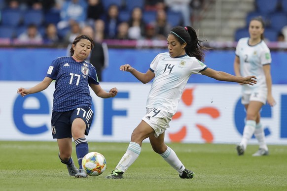 Japan&#039;s Narumi Miura, left, vies for the ball with Argentina&#039;s Miriam Mayorga during the Women&#039;s World Cup Group D soccer match between Argentina and Japan at the Parc des Princes in Pa ...