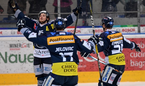 Ambri&#039;s player Dominic Zwerger, left, celebrates after scoring the 1-0 goal, during the fifth match of the playout final of the National League Swiss Championship between HC Ambri-Piotta and EHC  ...