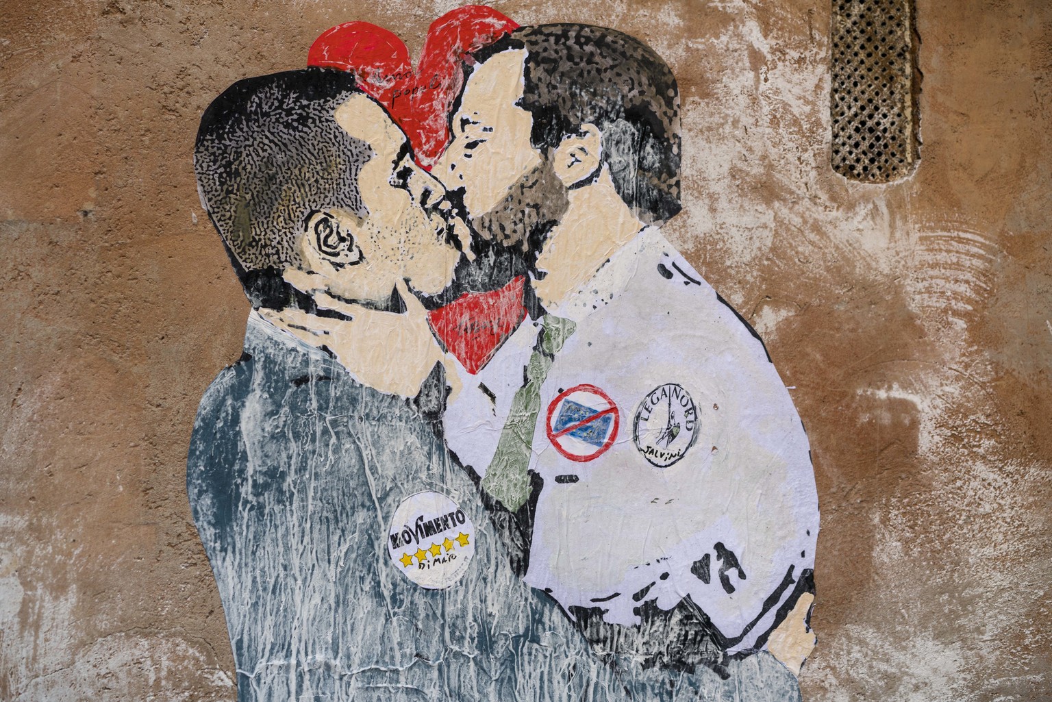 A mural shows 5-Star Movement&#039;s Luigi di Maio, left, and The League&#039;s leader Matteo Salvini kissing, on the same day that new members of Parliament were gathering in the two chambers to vote ...