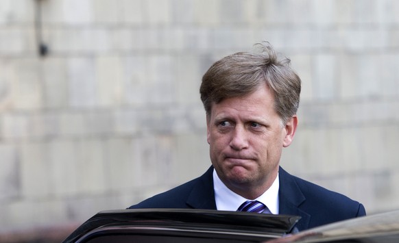 FILE - In this Wednesday, May 15, 2013 file photo the U.S. Ambassador to Russia Michael McFaul leaves the Foreign Ministry in Moscow, Russia. The U.S. ambassador to Russia has announced that he is ste ...