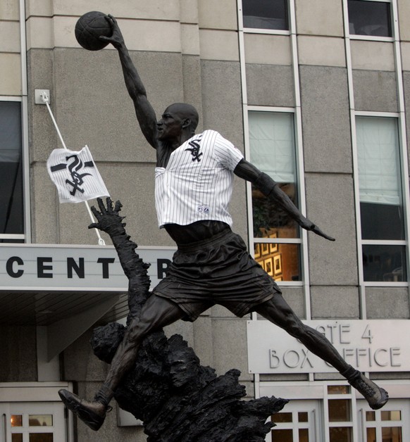 The statue of Michael Jordan sports a Chicago White Sox jersey outside the United Center in Chicago, Wednesday, Oct. 26, 2005. White Sox fans will be able to watch Game 4 of the World Series inside th ...