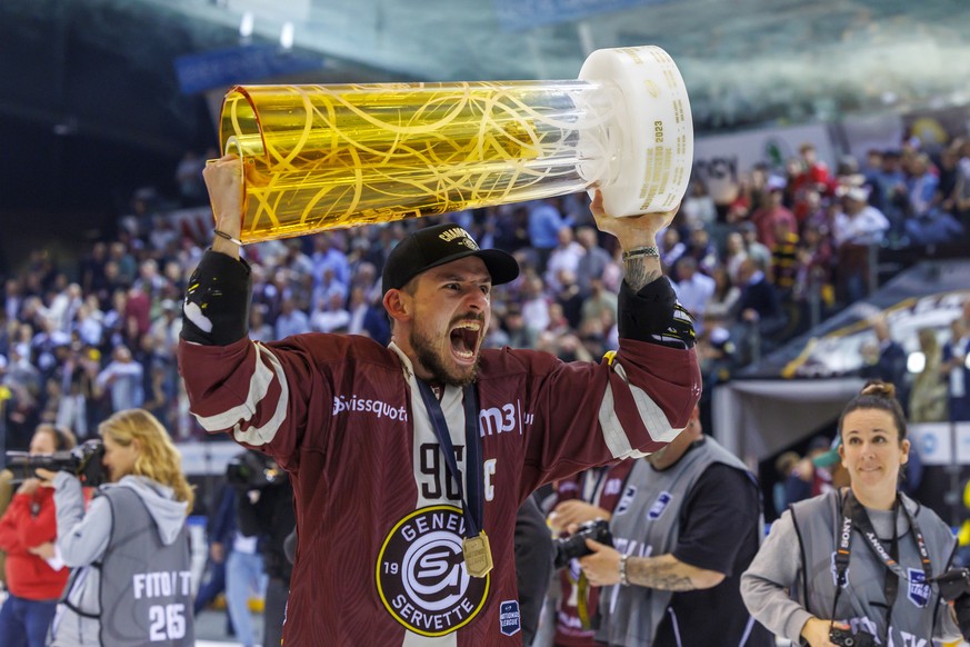 Geneve-Servette&#039;s forward Noah Rod celebrates with the trophy of Swiss Champion after winning by 4:1 the seventh and final leg of the ice hockey National League Swiss Championship final playoff g ...