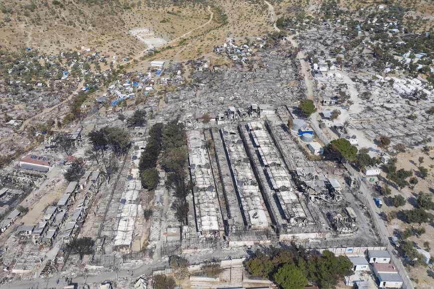 epa08767215 YEARENDER 2020.POLITICS..An image taken with a drone shows an aerial view of the burnt-down Moria refugee camp on Lesbos island, Greece, 14 September 2020. A fire broke out in the overcrow ...
