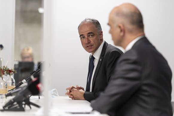 Federal coucillor and Swiss health minister Alain Berset, right, and Christophe Darbellay, President of the government of the canton Valais, talk to the media after their visit to Swiss pharma and bio ...