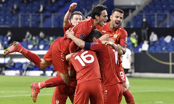 North Macedonia&#039;s Goran Pandev, right, is celebrated by his teammates after scoring his side&#039;s first goal during the World Cup 2022 group J qualifying soccer match between Germany and North  ...