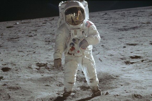 In this July 20, 1969 photo made available by NASA, astronaut Buzz Aldrin, lunar module pilot, walks on the surface of the moon during the Apollo 11 extravehicular activity. (Neil Armstrong/NASA via A ...