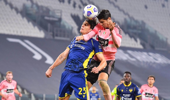 epa08773889 Juventus&#039; Alvaro Morata (R) and Verona&#039;s Giangiacomo Magnani (L) in action during the Italian Serie A soccer match between Juventus FC and Hellas Verona FC in Turin, Italy, 25 Oc ...